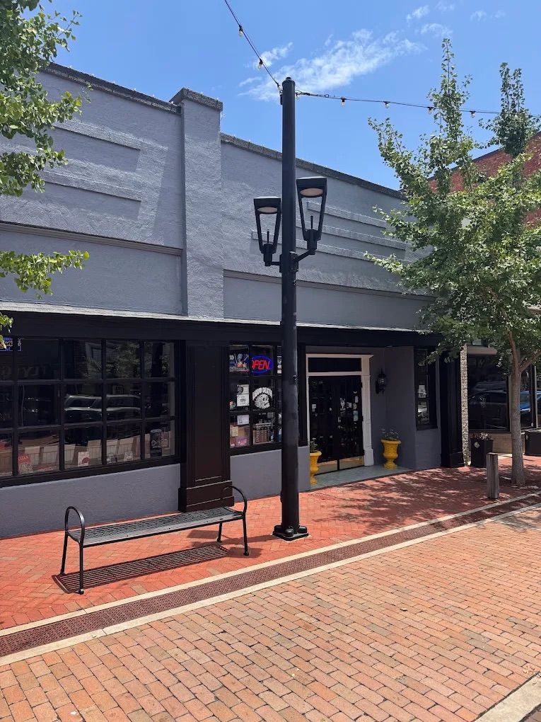 Storefront in downtown Greer SC repainted gray with black trim